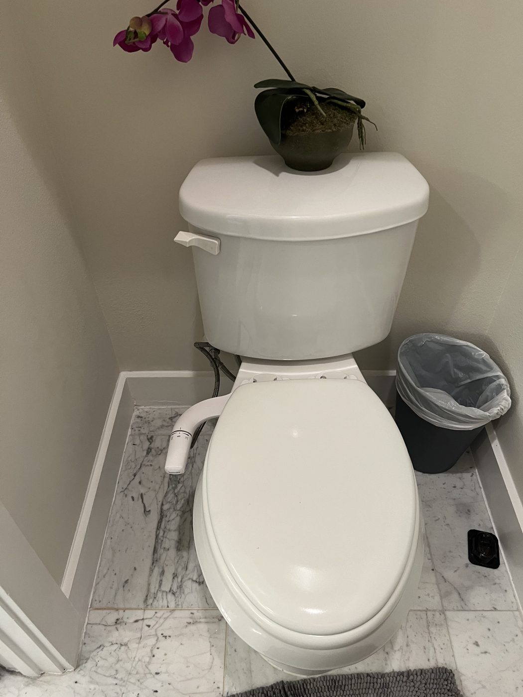 Toilet and bidet installed in marble powder room, Katy TX
